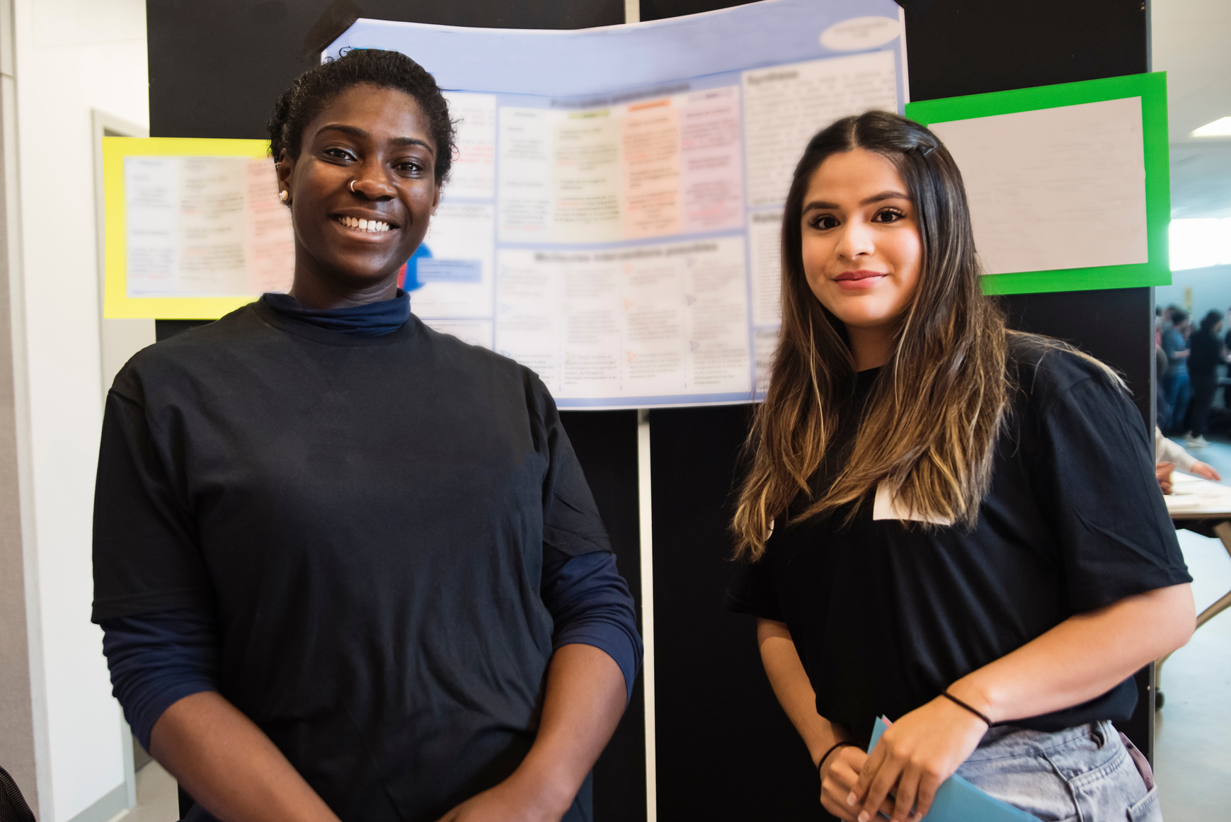 Portrait of young female college student in science fair.